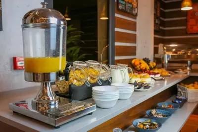 a blender sitting on top of a counter with food at Hotel Garni VIZURA Sport in Belgrade