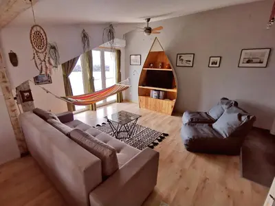 a living room with a couch and a chair at Gardos riverview in Belgrade