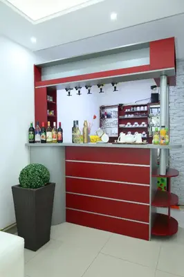 a kitchen with a red counter in a room at MK Star Boutique Hotel in Belgrade
