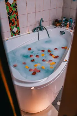 a bath tub with fish swimming in it at MK Star Boutique Hotel in Belgrade