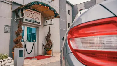 a car parked in front of a store at MK Star Boutique Hotel in Belgrade