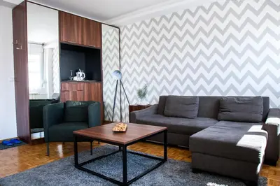 a living room with a couch and a table at Apartment Nikola Tesla in Belgrade