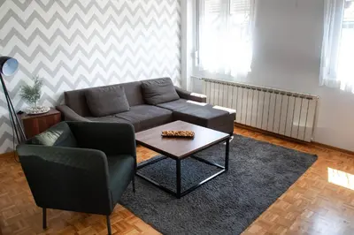 a living room with a couch and a coffee table at Apartment Nikola Tesla in Belgrade