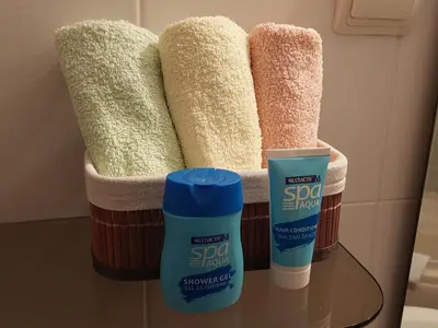 a group of towels on a table in a bathroom at Talas apartmani in Belgrade
