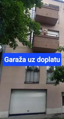 a building with a garza uszodaoda sign on it at Talas apartmani in Belgrade