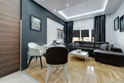 a living room with a couch and a table at CENTAR President in Arandjelovac