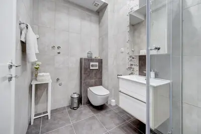 a bathroom with a toilet and a sink and a shower at CENTAR President in Arandjelovac