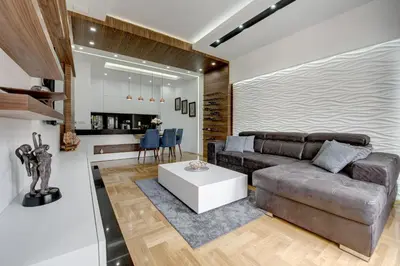 a living room with a couch and a table at CENTAR President in Arandjelovac