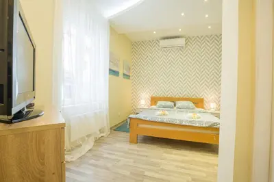 a bedroom with a bed and a television in it at Belgrade Center Apartment Skadarlija II in Belgrade