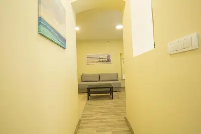 a hallway with a couch in a room at Belgrade Center Apartment Skadarlija II in Belgrade