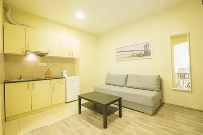 a living room with a couch and a table at Belgrade Center Apartment Skadarlija II in Belgrade