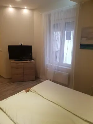 a bedroom with a bed and a window at Belgrade Center Apartment Skadarlija II in Belgrade