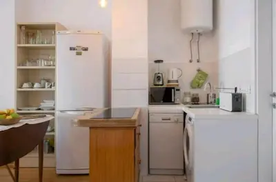 a kitchen with white appliances and a white refrigerator at Danube Pearl in Belgrade