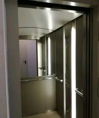 a bathroom with a glass shower with a mirror at Danube Pearl in Belgrade