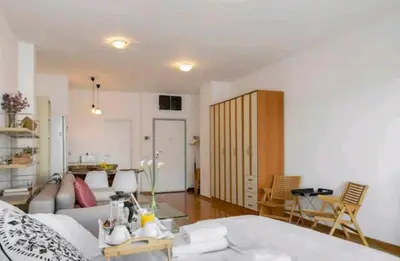 a living room with a bed and a couch at Danube Pearl in Belgrade