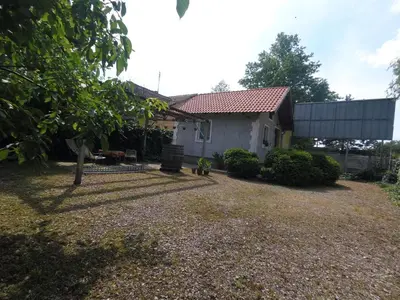 a house with a gravel yard in front of it at Hostel Respect in Pančevo