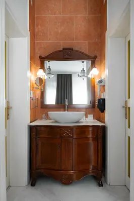 a bathroom with a sink and a mirror at Hotel Jardin in Belgrade