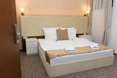 a bedroom with a large bed with white pillows at Luxury Rooms Skadarlija in Belgrade