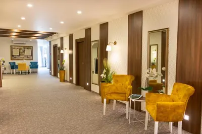 a hallway with chairs and a table in a hotel room at Luxury Rooms Skadarlija in Belgrade