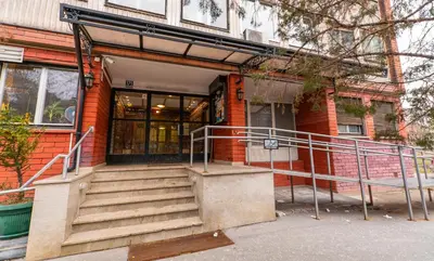 a building with stairs in front of a building at Burgundy Apartment in Belgrade