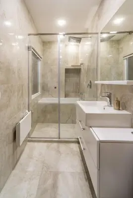 a bathroom with a sink and a shower and a tub at Royal Knez in Belgrade