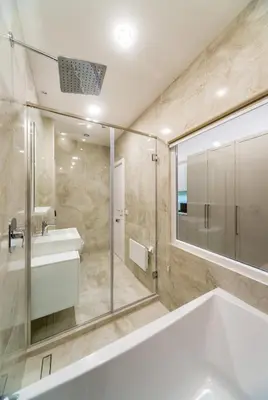 a bathroom with a tub and a sink and a mirror at Royal Knez in Belgrade