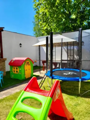 a playground with a trampoline and a play set at Villa Mystique in Belgrade