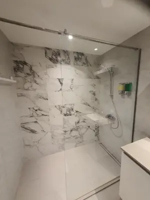 a bathroom with a shower and a sink at Belgrade Waterfront - Beograd na vodi in Belgrade