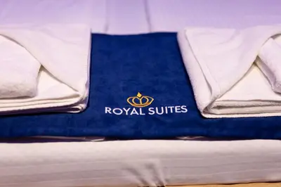 a blue towel sitting on top of a bed at Royal Suites in Belgrade