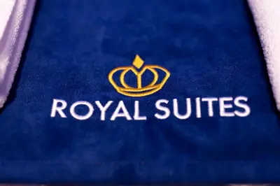 a blue book with a royal suites logo on it at Royal Suites in Belgrade