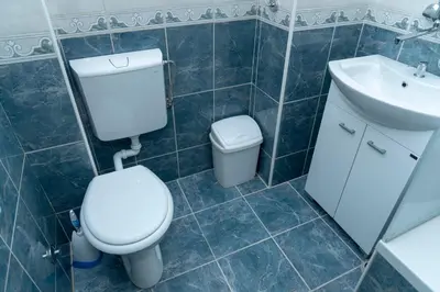 a bathroom with a toilet and a sink at Sweet House Trg in Belgrade