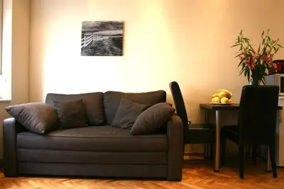 a living room with a couch and a table at Belgrade Stay Apartments in Belgrade