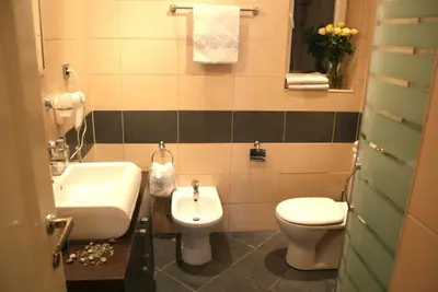 a bathroom with a toilet and a sink at Belgrade Stay Apartments in Belgrade