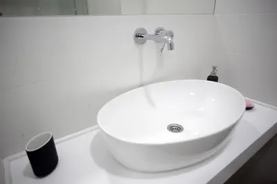a white sink on a white counter in a bathroom at City Center Belgrade Cozy Apartment Skadarlija in Belgrade