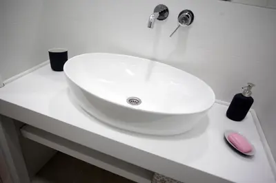 a white sink on a white counter in a bathroom at City Center Belgrade Cozy Apartment Skadarlija in Belgrade