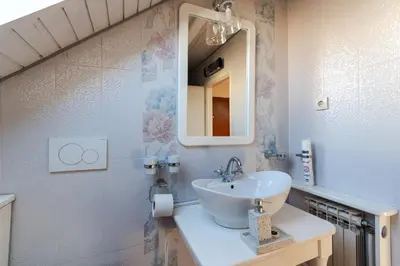 a bathroom with a sink and a mirror at KLARA VRACAR 90 m2, dve i po spavace sobe in Belgrade
