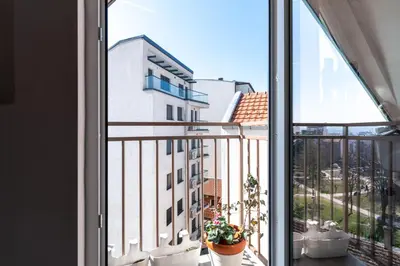 an apartment balcony with a view of a building at KLARA VRACAR 90 m2, dve i po spavace sobe in Belgrade