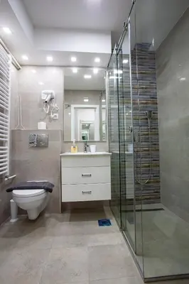 a bathroom with a toilet and a glass shower at Tamy lux apartment in Belgrade