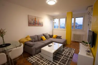 a living room with a couch and a table at Tamy lux apartment in Belgrade