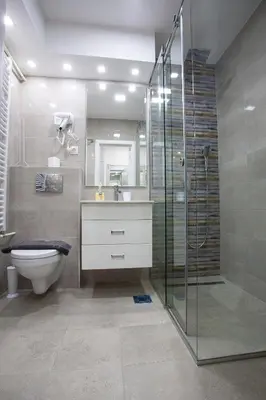 a bathroom with a toilet and a glass shower at Tamy lux apartment in Belgrade