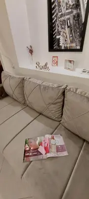 a magazine sitting on top of a couch at White Pearl in Belgrade