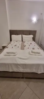 a bed with two pillows on it in a room at White Pearl in Belgrade
