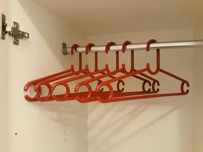 a metal towel rack hanging on a wall at White Pearl in Belgrade