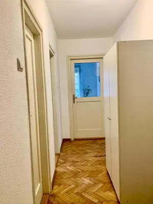 an empty hallway with a door and a window at Star apartment 2 in Belgrade