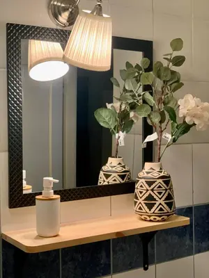 a bathroom with two vases and a mirror at Star apartment 2 in Belgrade