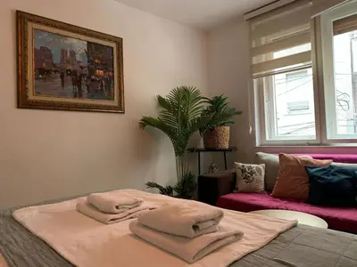 a bedroom with a bed with towels on it at Star apartment 2 in Belgrade