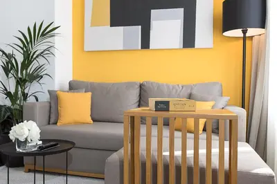 a living room with a couch and a table at Dominic Smart & Luxury Suites - Terazije in Belgrade