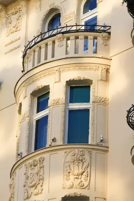 a white building with windows and a balcony at Dominic Smart & Luxury Suites - Terazije in Belgrade