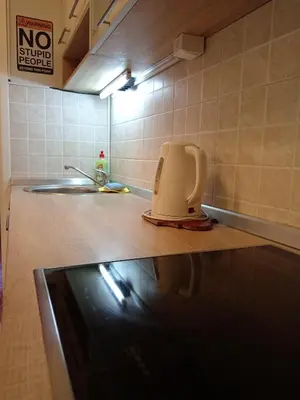 a kitchen with a toaster sitting on a counter at Two Rivers Apartment in Belgrade
