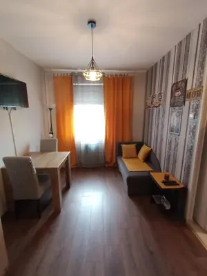 a living room with a couch and a table at Two Rivers Apartment in Belgrade